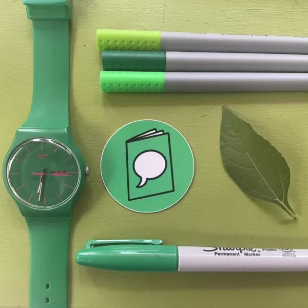 a green speech bubble sticker surrounded by other green objects