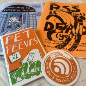 a pack of three zines about computer science and a sticker